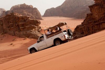 Full-Day Jeep Safari "Wadi Rum Highlights!" w/ Bedouin Lunch - Getting to Wadi Rum Rest House and riding in the open-air Jeep