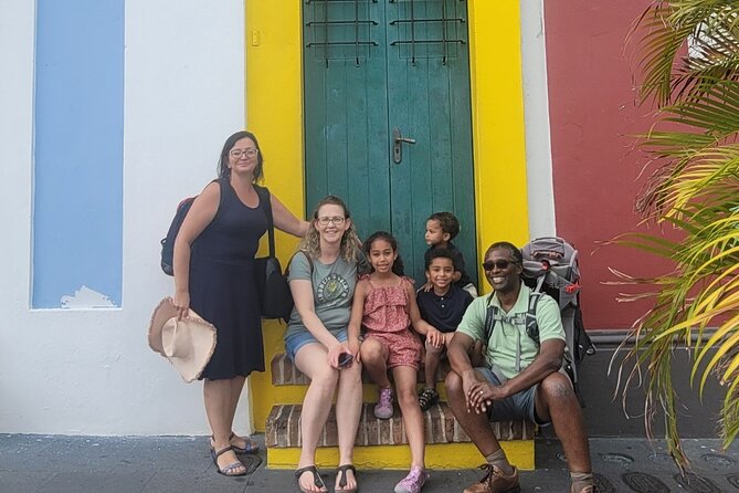 Intensive Old San Juan Opulent Coffee/Rum/Tastings Walking Tour - Passing the Gate of San Juan and the walk-tree landmark